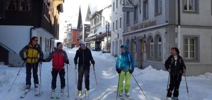 Skiers enjoying Andermatt's picturesque town centre